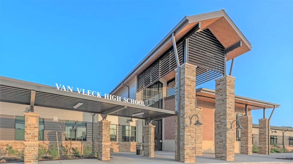 Van Vleck ISD - 2017 Bond Projects: High School & Junior High School  Size: 500,000 sq ft / Timeline: 2016 - 2017  / Built Type: New Construction  Van Vleck ISD’s 2017 Bond included a 500 student high school, 350 student junior high school, and a replacement elementary school.  These new schools included a variety of spaces for teaching and learning including various classroom wings focused on a central library media center.  Welcoming front entries lead visitors through security vestibules into the main lobby, directly adjacent to administration.  The 77,000 SF replacement elementary includes next generation learning spaces and other common areas to promote an open learning environment.  Students of all ages will benefit from this improvements package which includes classrooms, science labs, special education spaces, library, music rooms, cafeteria with stage, new gymnasium, full commercial kitchen, administrative offices, and custodial.   Back to Portfolio 