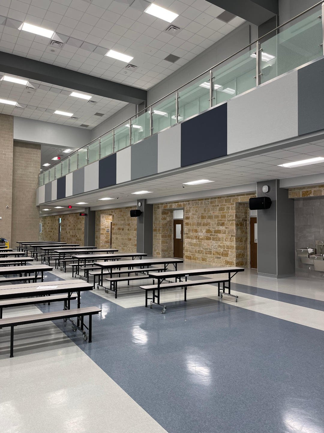 New Braunfels ISD – New Braunfels Middle School  New Braunfels Middle School is a 190,682 SF, two-story building on a 67 acre site.  Construction elements include a structural void form slab, steel frame, modified bitumen and standing seam roofing, porcelain tile, and LVT flooring.  The exterior is clad with face brick, natural stone, and metal panels.  The facility includes classrooms, wood floor gymnasiums, science labs, food service, administration, and fine arts areas.  On site improvements include concrete paving, covered walkways, site utilities, athletic fields, running track, and tennis courts.  Back to Portfolio 