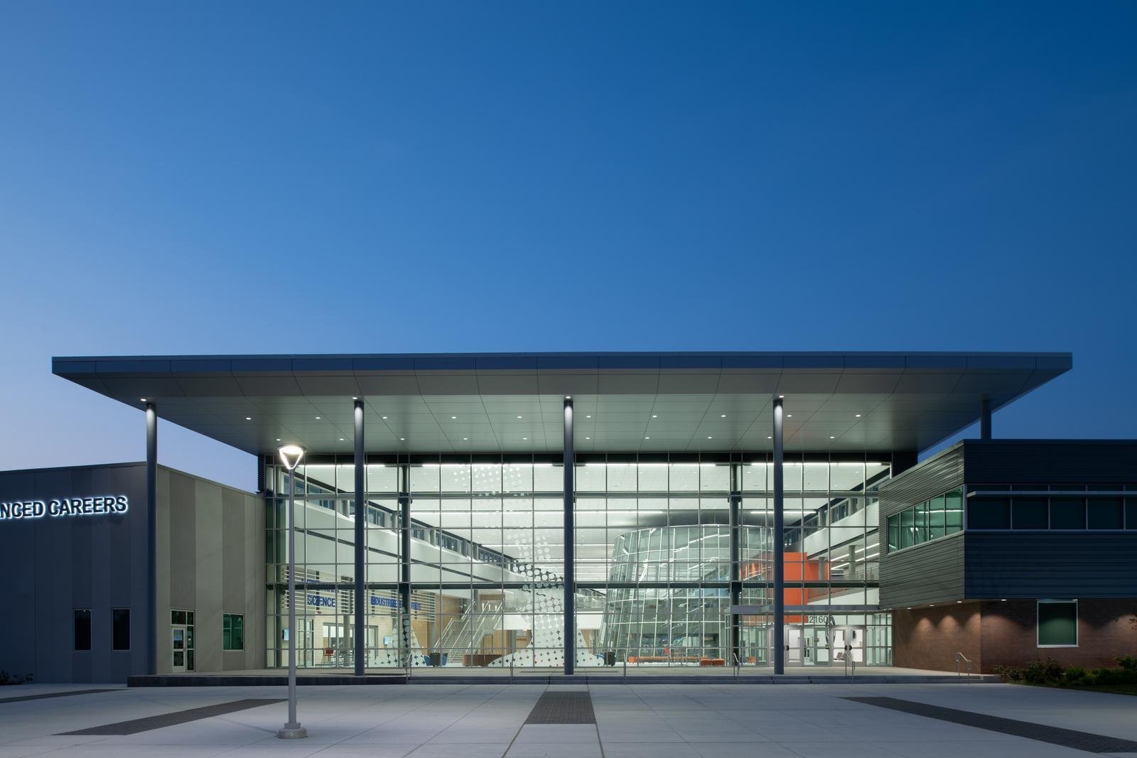 Alief ISD – Career & Technical Education High SchoolTechnology is paramount on this cutting edge project, evidenced by the utilization of a significant quantity of dynamic glass in the exterior windows.  The structure is a hybrid of Class A structural steel and a significant quantity of insulated concrete tilt walls, while interior partitions are chiefly CMU.  Building flooring is primarily a combination of polished concrete, terrazzo and resinous floors.  Interiors are also set off by striking glass handrail systems and high volume spaces.  Specialty installations to facilitate career training include automotive bays, dog kennels, wood working shops, welding shops and robotics labs.Back to Portfolio