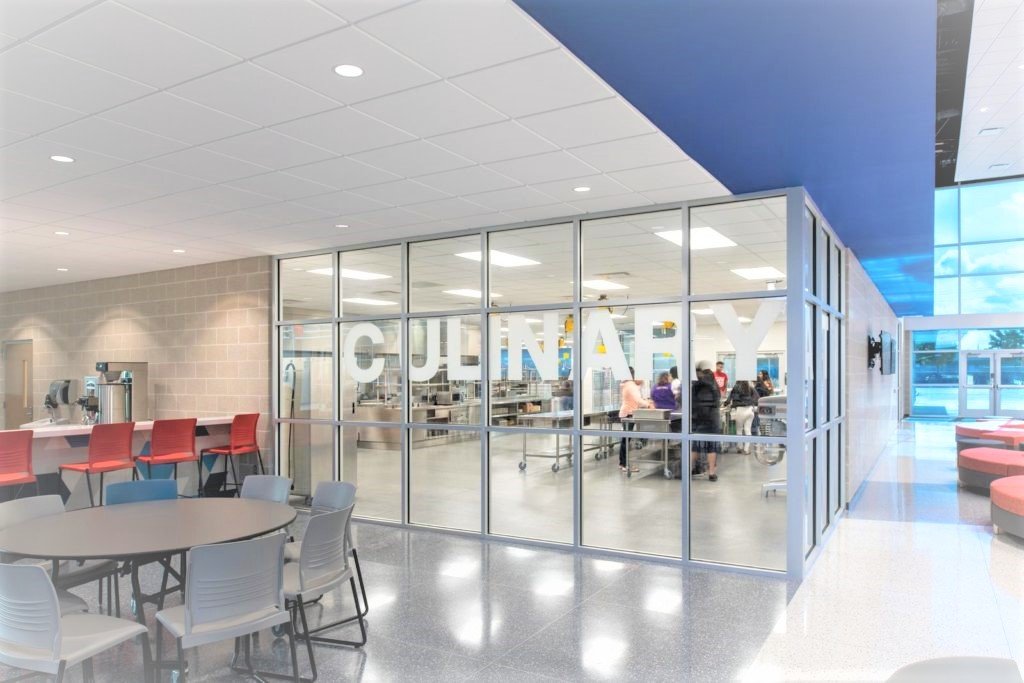 Alief ISD – Career & Technical Education High SchoolTechnology is paramount on this cutting edge project, evidenced by the utilization of a significant quantity of dynamic glass in the exterior windows.  The structure is a hybrid of Class A structural steel and a significant quantity of insulated concrete tilt walls, while interior partitions are chiefly CMU.  Building flooring is primarily a combination of polished concrete, terrazzo and resinous floors.  Interiors are also set off by striking glass handrail systems and high volume spaces.  Specialty installations to facilitate career training include automotive bays, dog kennels, wood working shops, welding shops and robotics labs.Back to Portfolio