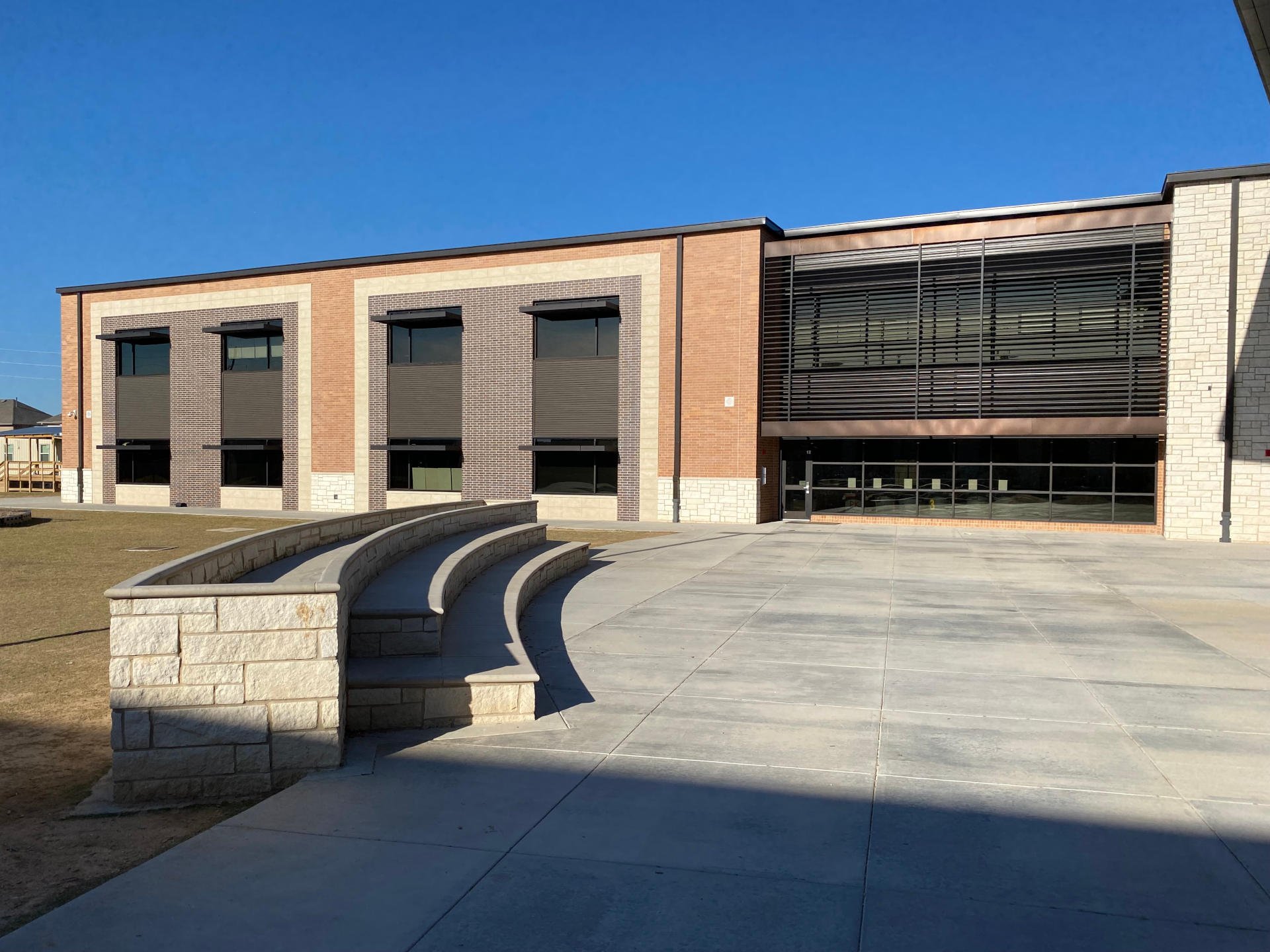 Katy ISD – McElwain Elementary SchoolProject consisted of new 137,674 SF two-story elementary which was completed in June 2020. The exterior of the building has a combination of natural stone, cast stone, face brick, Architectural metal wall panels, metal sun shades and a mod bit roof system.  The outdoor activity area includes a playground equipment area, outdoor basketball court and an amphitheater. Interior finishes include porcelain floor tiles and luxury vinyl tile corridors with ceramic tile wainscot.Back to Portfolio