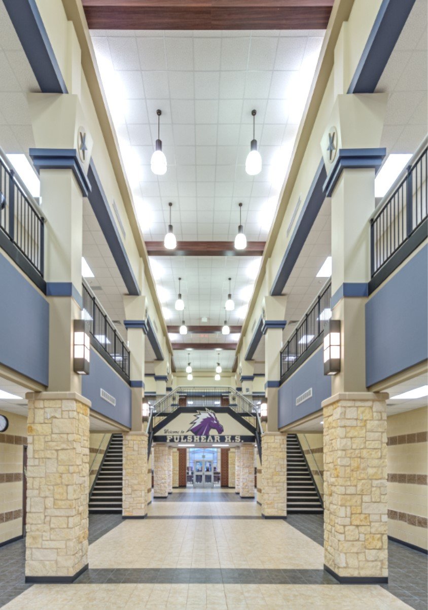 Lamar Consolidated ISD – Churchill Fulshear Jr. - High School & Dean Leaman Junior High SchoolThe Lamar CISD Churchill Fulshear High School and Dean Leaman Junior High School educational complex encompasses a 166 acre site. The approximately 590,000 SF of structures are comprised of a two-story high school, two-story junior high school, a single story athletic field house, single story transportation building, concession stands and ticket booths. Other elements include a competition football field, running track and field events, several football/soccer practice fields, baseball field, softball field, tennis courts, detention pond and extensive concrete paving. All structures are covered with standing seam metal roofing and include striking architectural features such as natural stone accents and expansive main street corridors. Back to Portfolio